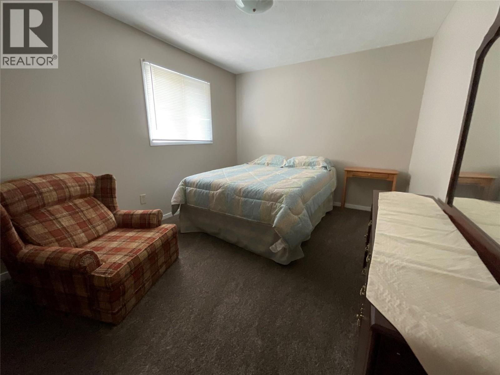 64 Merrick Place, Tumbler Ridge, BC - Indoor Photo Showing Bedroom