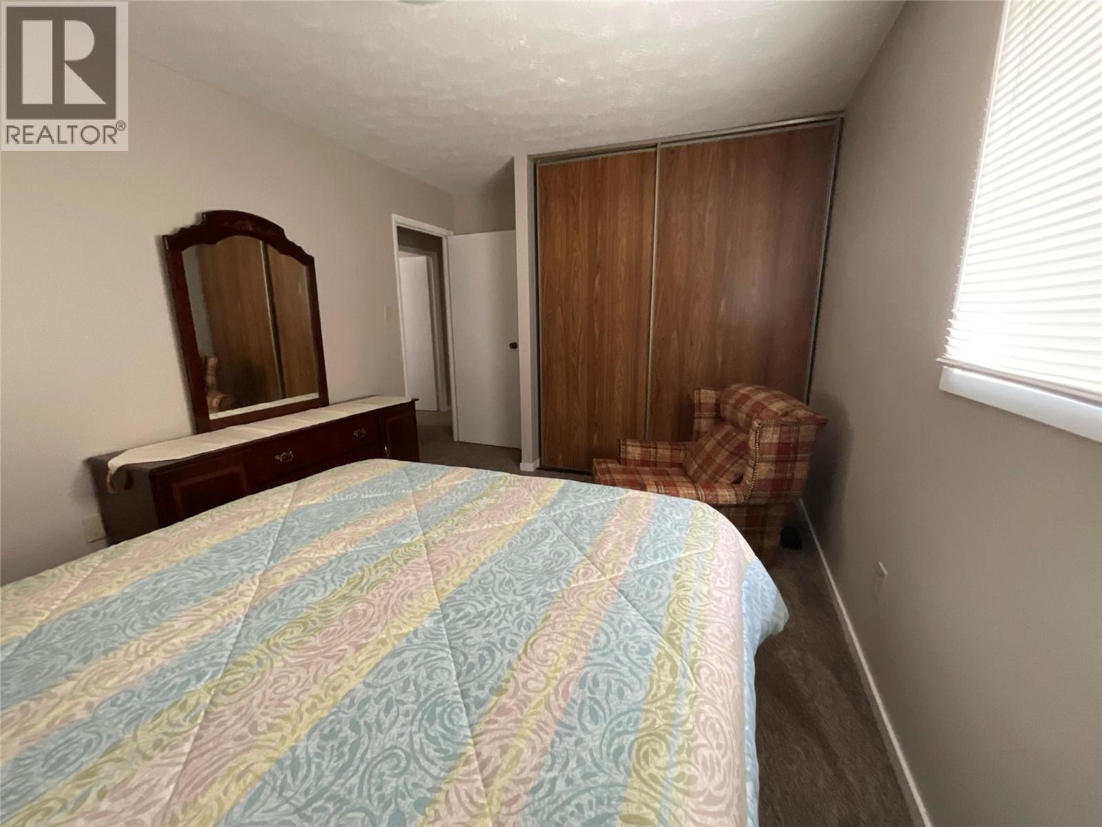 64 Merrick Place, Tumbler Ridge, BC - Indoor Photo Showing Bedroom