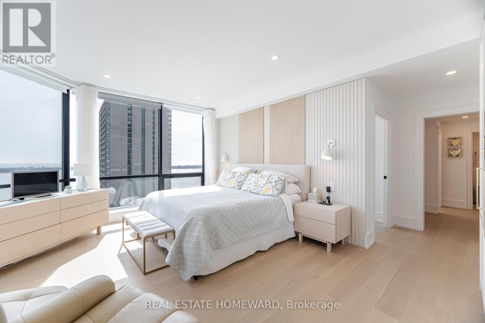 Paneled wall w/ scones - Ph2 - 10 Queens Quay W, Toronto, ON - Indoor Photo Showing Bedroom