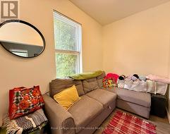 Bright living area in upper unit. -