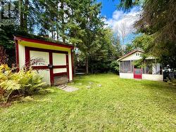 Mature trees line the private, large backyard. -