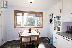 An eat in kitchen nook overlooks the river. -