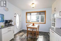 The kitchen leads to the back deck. -