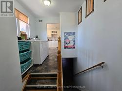 The landing leading to the garage and basement. -