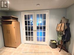 French doors to the basement family room. -