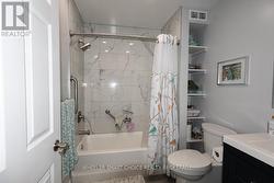 Beautiful tiles in the updated main floor bathroom -