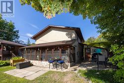 Fabulous sunroom overlooks backyard oasis -