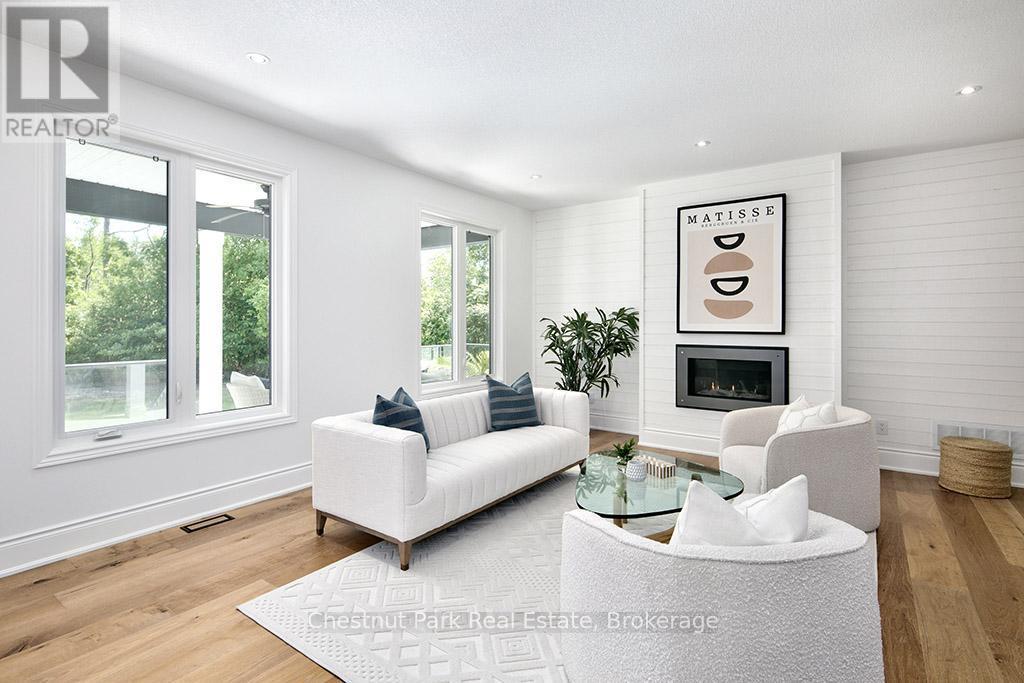 2237 Shore Lane, Wasaga Beach, ON - Indoor Photo Showing Living Room With Fireplace