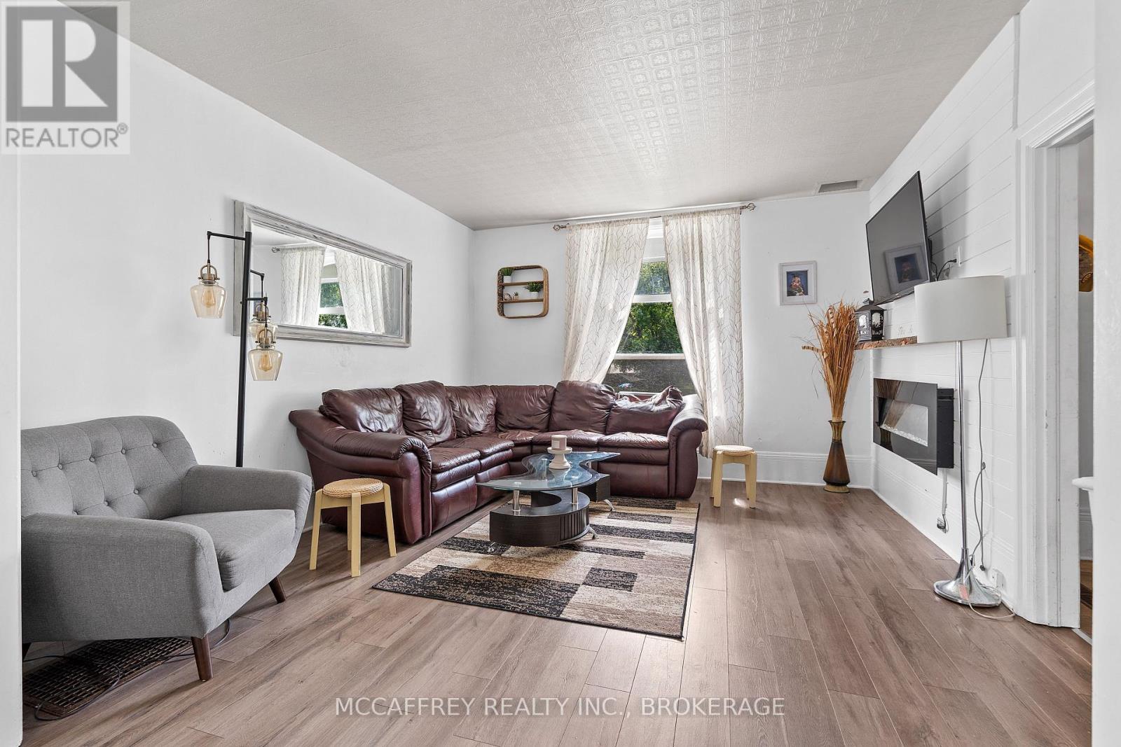 110 Adelaide Street, Front Of Leeds & Seeleys Bay, ON - Indoor Photo Showing Living Room With Fireplace