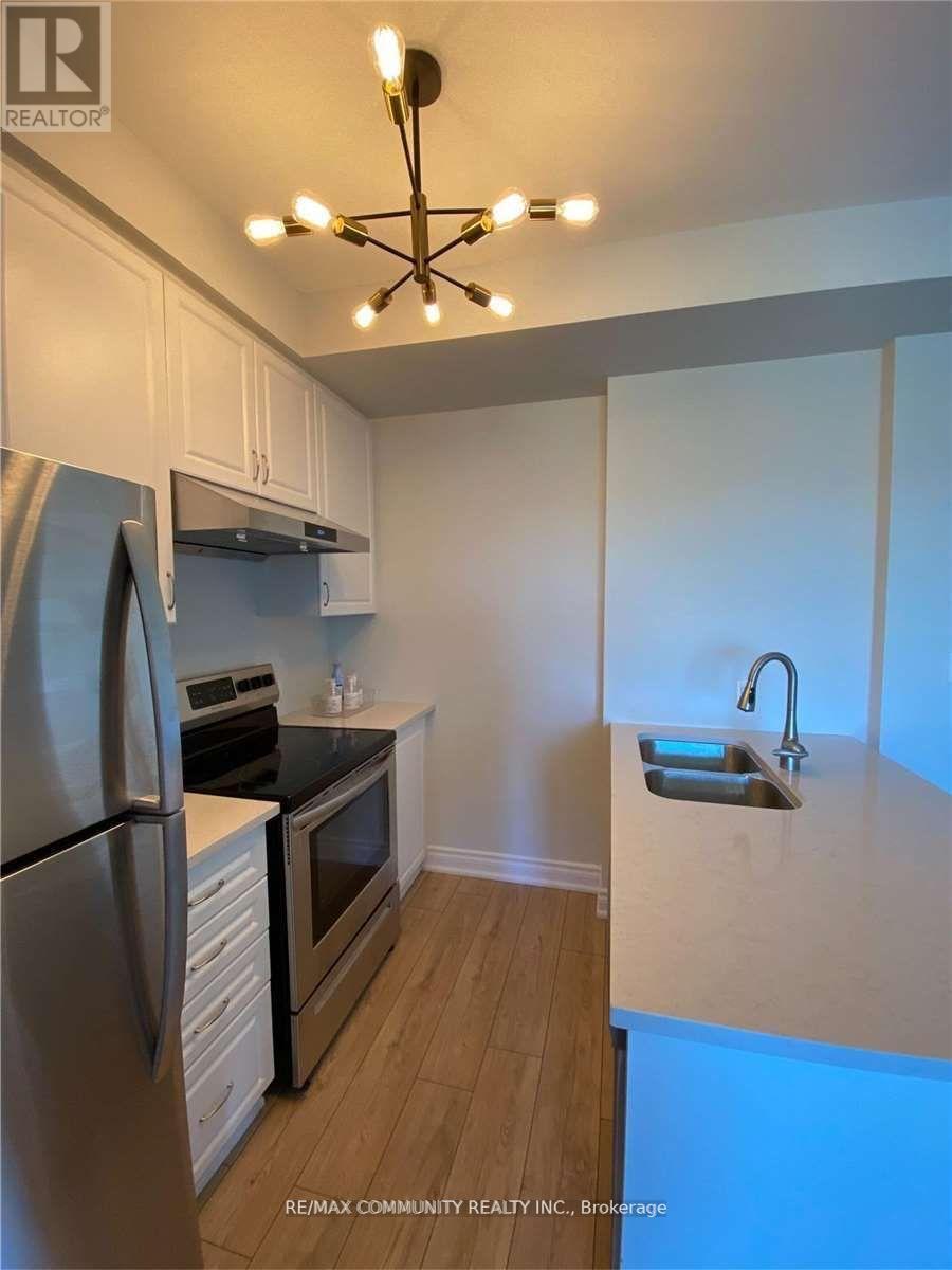 413 - 58 Adam Sellers Street E, Markham, ON - Indoor Photo Showing Kitchen With Stainless Steel Kitchen With Double Sink