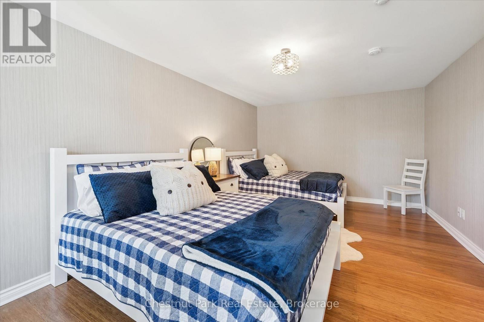 Spacious guest suite- nature vistas & ample closet - 31-303 - 1235 Deerhurst Drive, Huntsville (Chaffey), ON - Indoor Photo Showing Bedroom