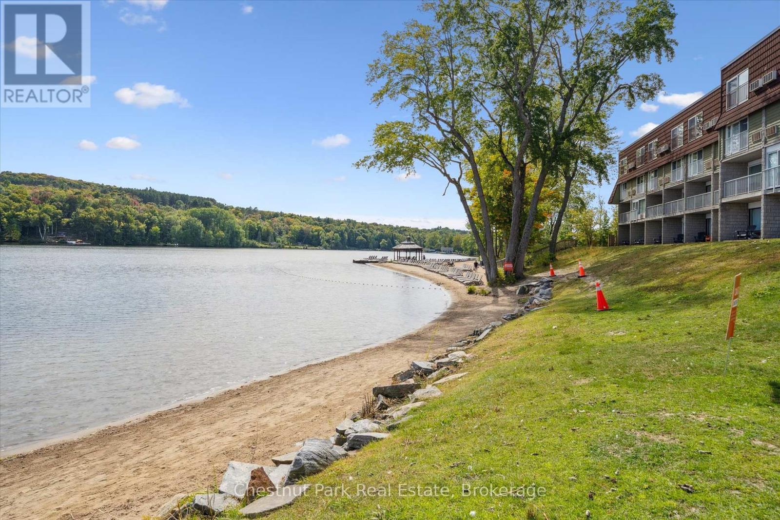 Beautiful beachfront on Peninsula Lake - 31-303 - 1235 Deerhurst Drive, Huntsville (Chaffey), ON - Outdoor With Body Of Water With View