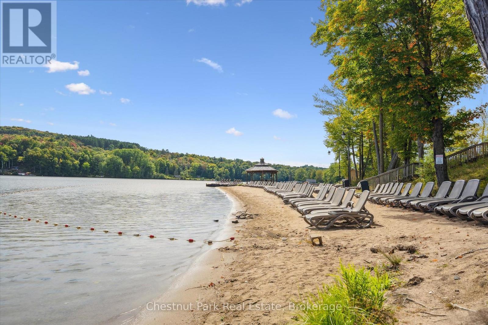 Wonderful Beach located only 5 minutes away - 31-303 - 1235 Deerhurst Drive, Huntsville (Chaffey), ON - Outdoor With Body Of Water With View