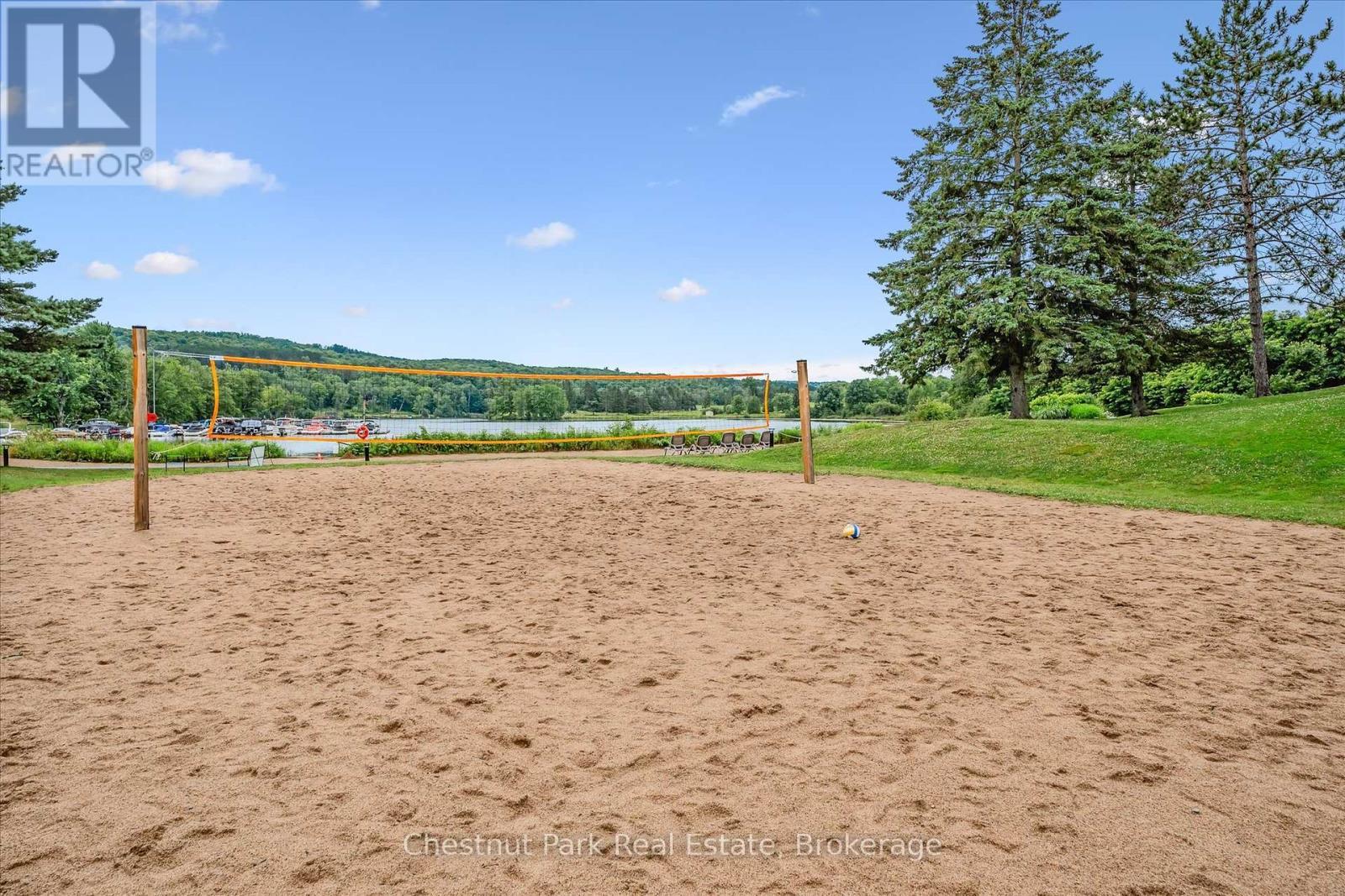 Beach Volleyball Court on Sunset Bay - 31-303 - 1235 Deerhurst Drive, Huntsville (Chaffey), ON - Outdoor With View