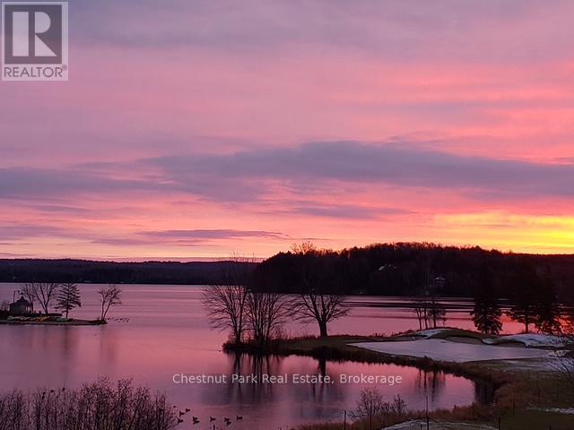 The sunrise - 31-303 - 1235 Deerhurst Drive, Huntsville (Chaffey), ON - Outdoor With Body Of Water With View