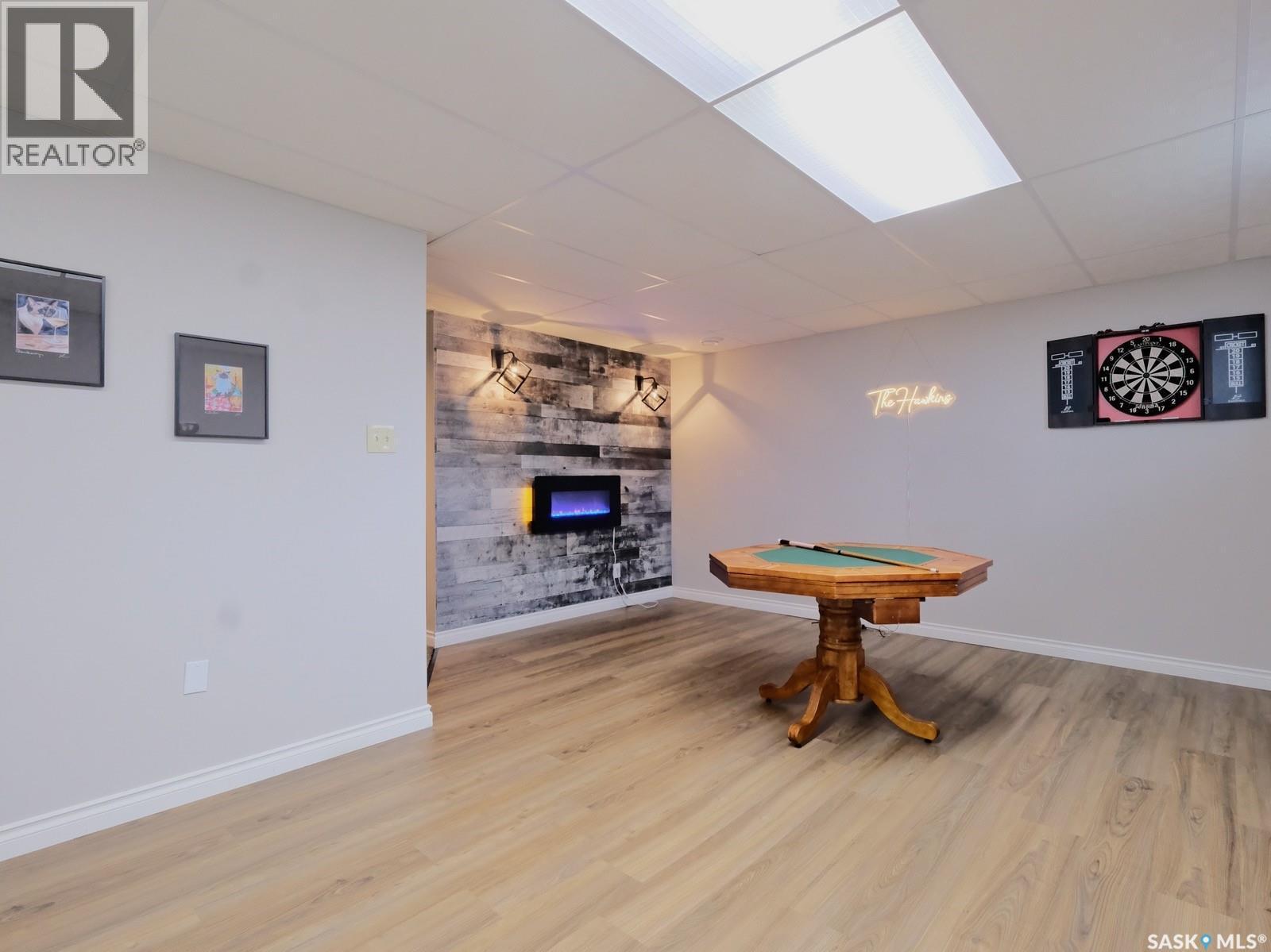 106 8Th Avenue W, Biggar, SK - Indoor Photo Showing Other Room With Fireplace