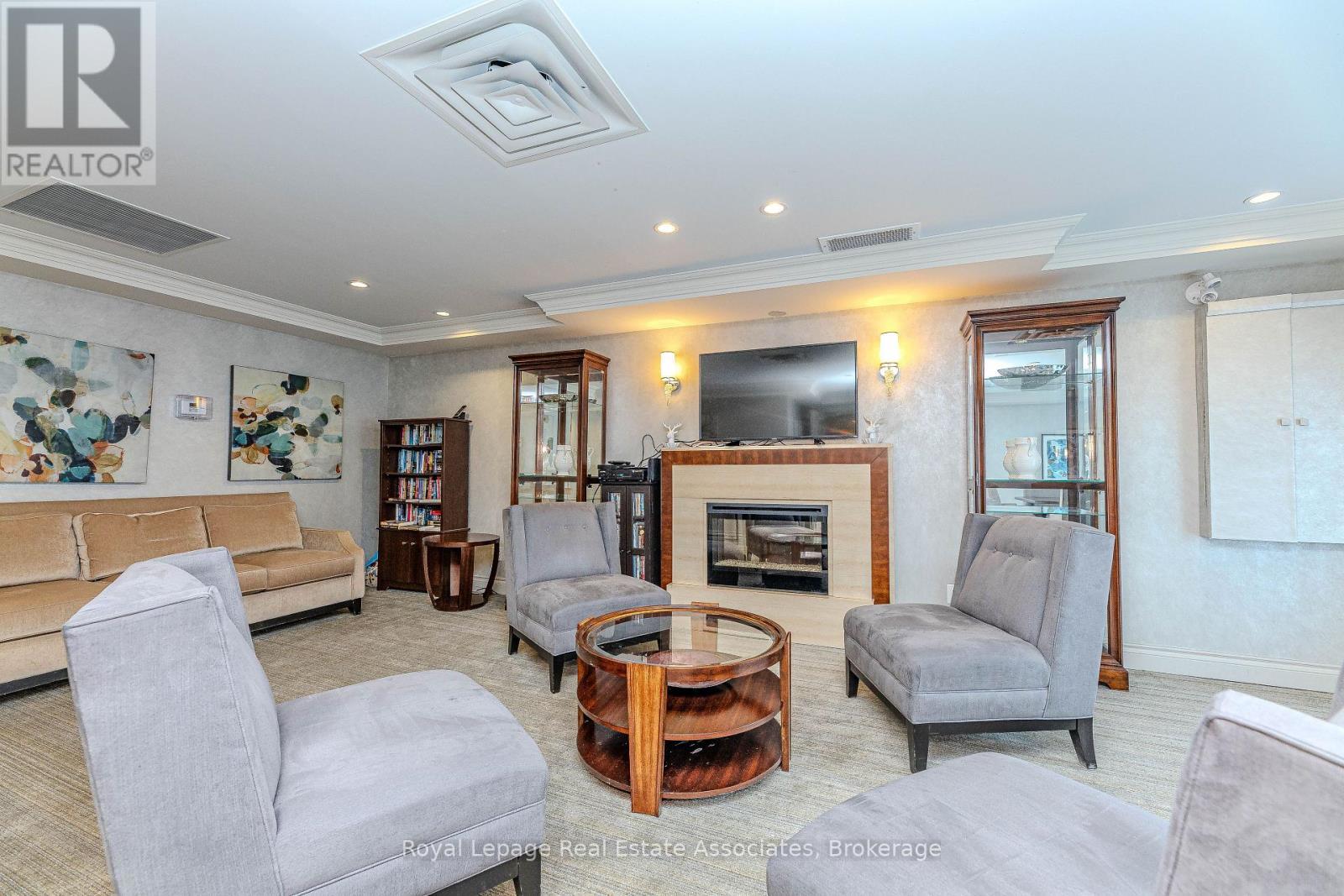 202 - 60 Via Rosedale Way, Brampton, ON - Indoor Photo Showing Living Room With Fireplace