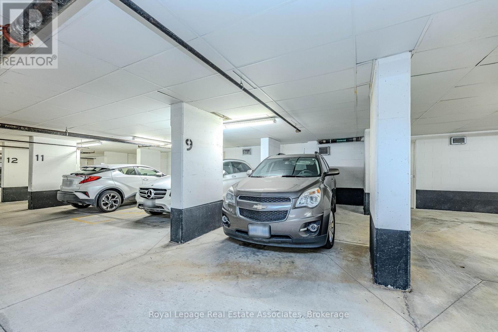 202 - 60 Via Rosedale Way, Brampton, ON - Indoor Photo Showing Garage