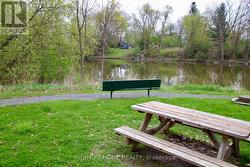 With a walking path and seating area. -