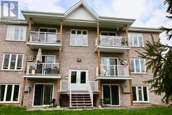 On ground level on right. -