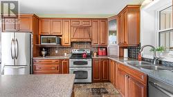 Kitchen w/stone floor, custom cabinets etc -