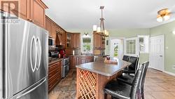 Kitchen w/stone floor, custom cabinets etc -