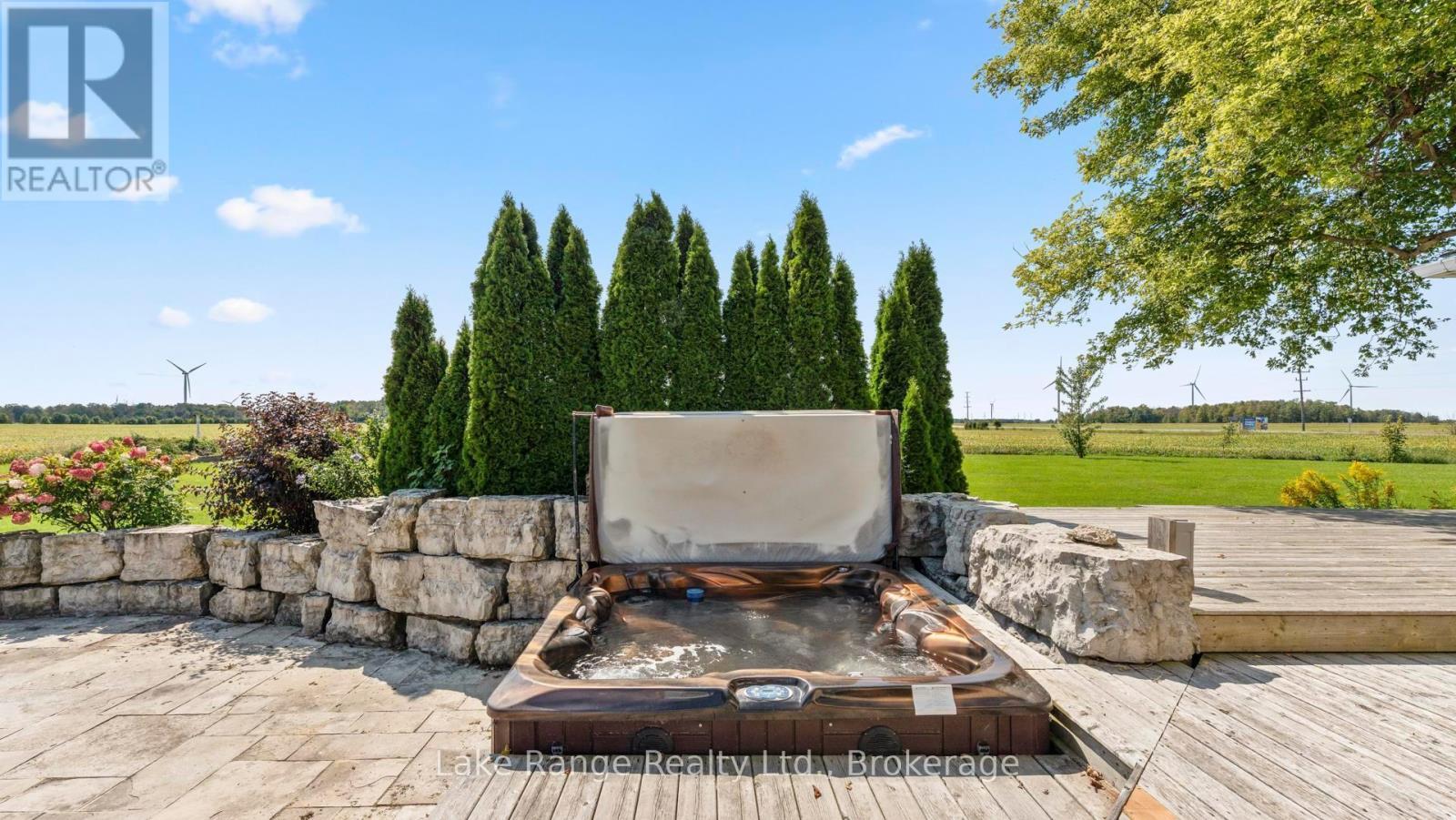 Stone patio and hot tub - 3622 Highway 21, Kincardine, ON - Outdoor With Deck Patio Veranda