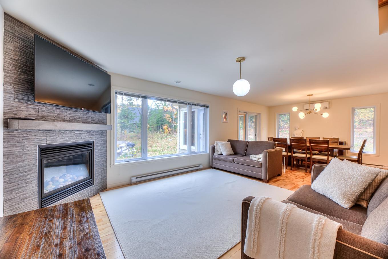Salon - 600 Ch. Olivier, Saint-Côme, QC - Indoor Photo Showing Living Room With Fireplace