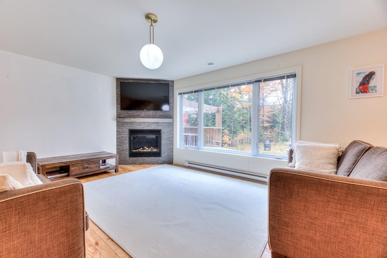 Salon - 600 Ch. Olivier, Saint-Côme, QC - Indoor Photo Showing Living Room With Fireplace