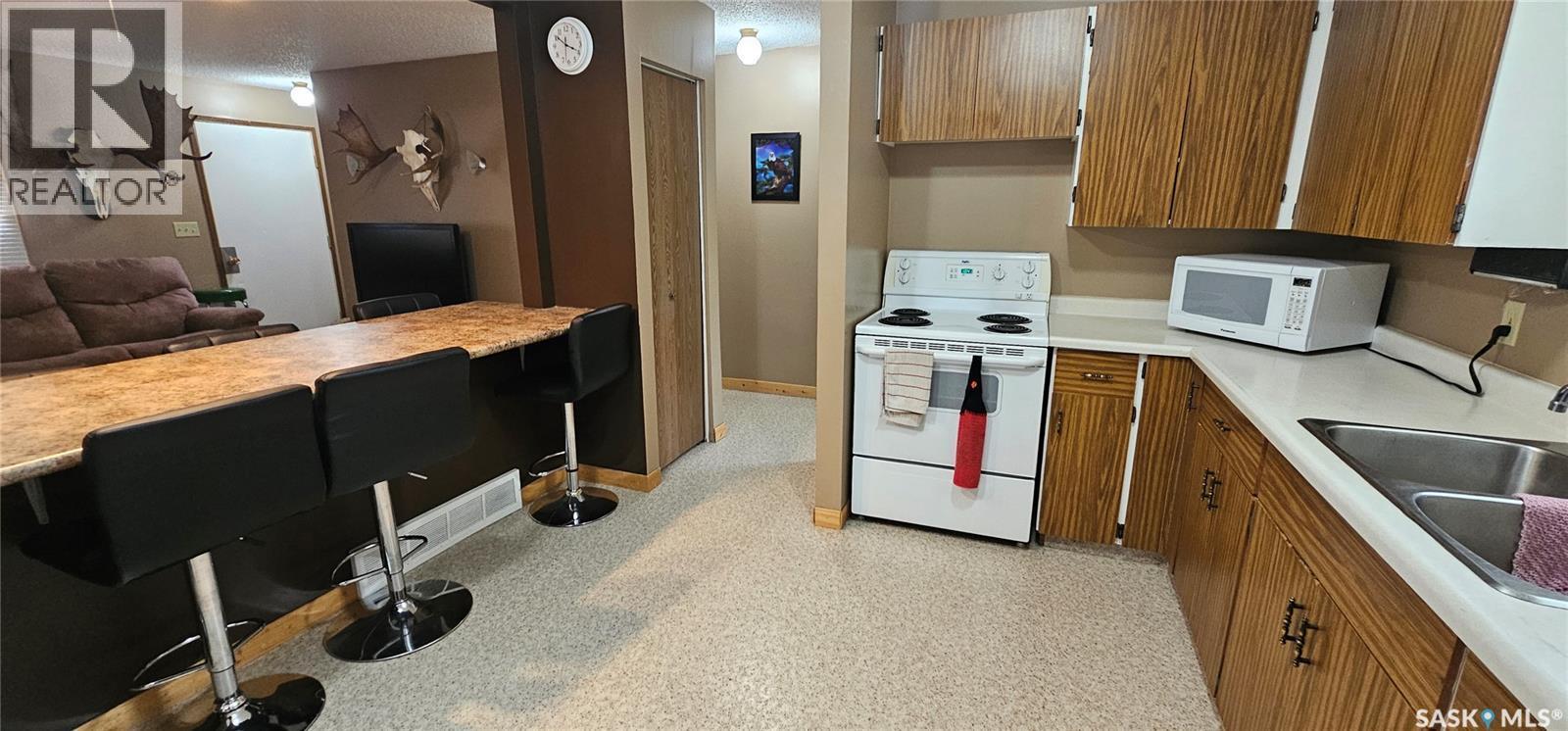 65 2Nd Street W, Weekes, SK - Indoor Photo Showing Kitchen With Double Sink
