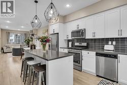 Bright spacious kitchen with gas stove -