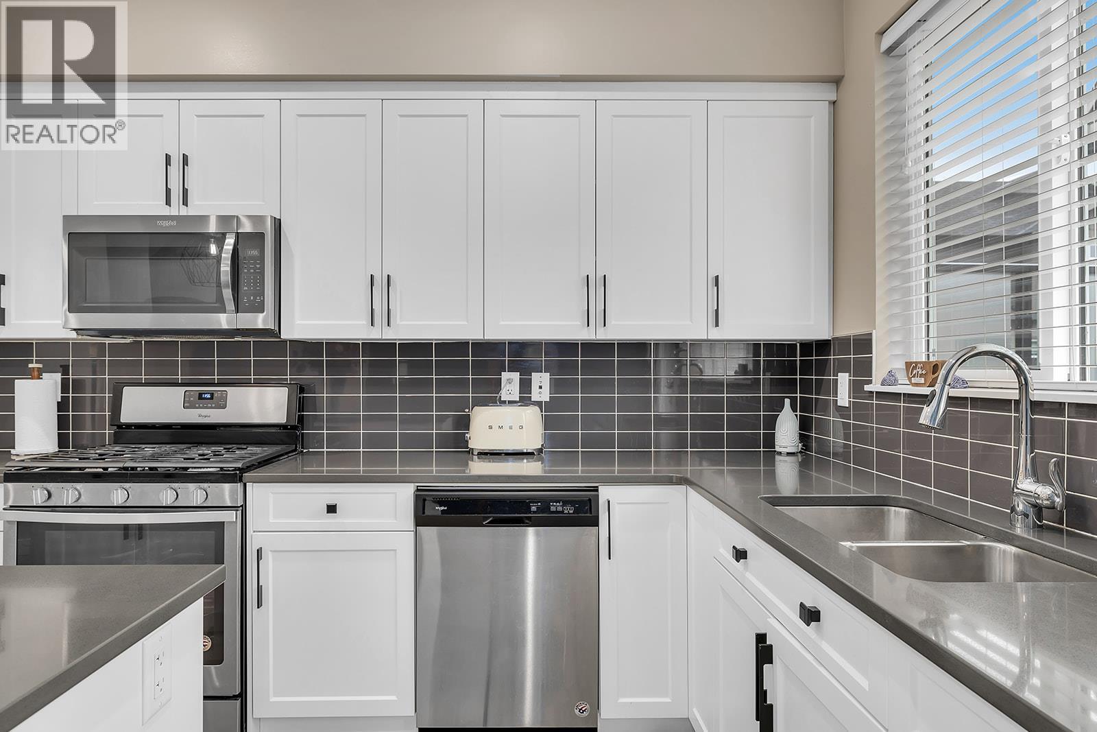 2490 Tuscany Drive Unit# 24, West Kelowna, BC - Indoor Photo Showing Kitchen With Stainless Steel Kitchen With Double Sink With Upgraded Kitchen