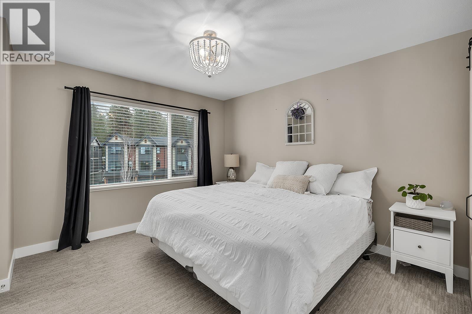 Primary Bedroom - 2490 Tuscany Drive Unit# 24, West Kelowna, BC - Indoor Photo Showing Bedroom