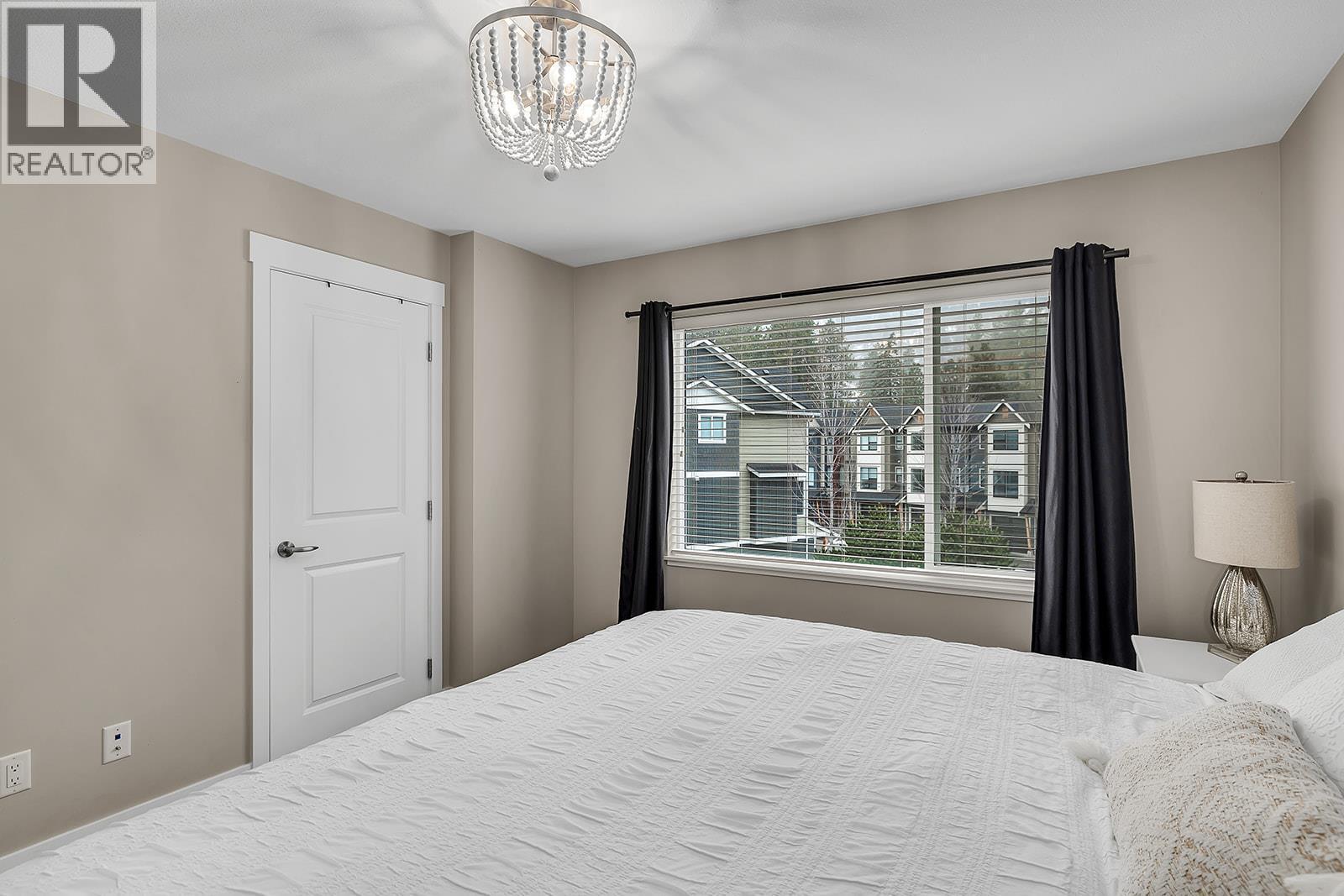 Primary Bedroom - 2490 Tuscany Drive Unit# 24, West Kelowna, BC - Indoor Photo Showing Bedroom