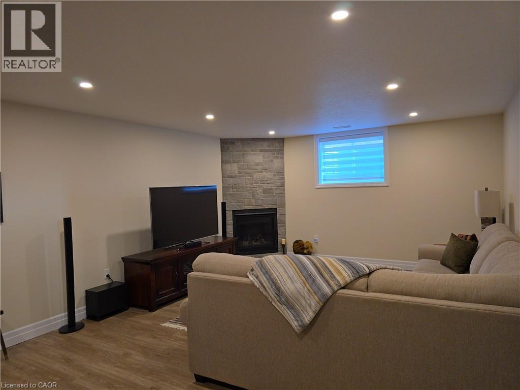1095 Kincaid Street, Listowel, ON - Indoor Photo Showing Basement With Fireplace