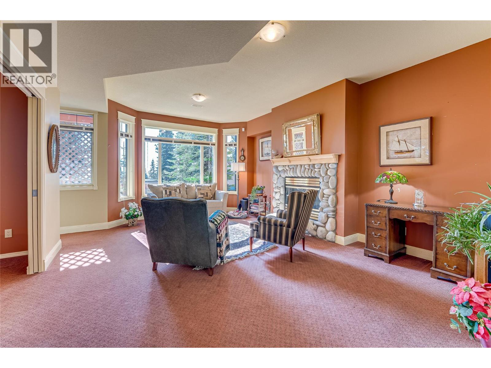 635 Monashee Road Unit# 8, Silver Star, BC - Indoor With Fireplace