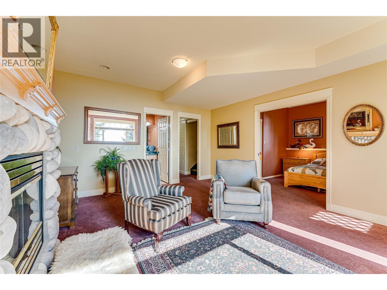 635 Monashee Road Unit# 8, Silver Star, BC - Indoor Photo Showing Other Room With Fireplace