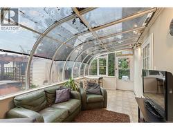 SUNROOM - Could be used as greenhouse too! Door to back yard and doors to both bedrooms! -