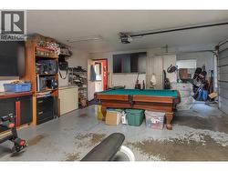 GARAGE - 20x20 Double Garage with enough room for 2 smaller vehicles, tons of extra storage! Currently used as Man-Cave! -