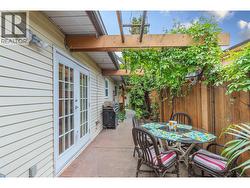 BACK PATIO - Stamped Concrete and lots of quiet, private space off the kitchen/dining room! -