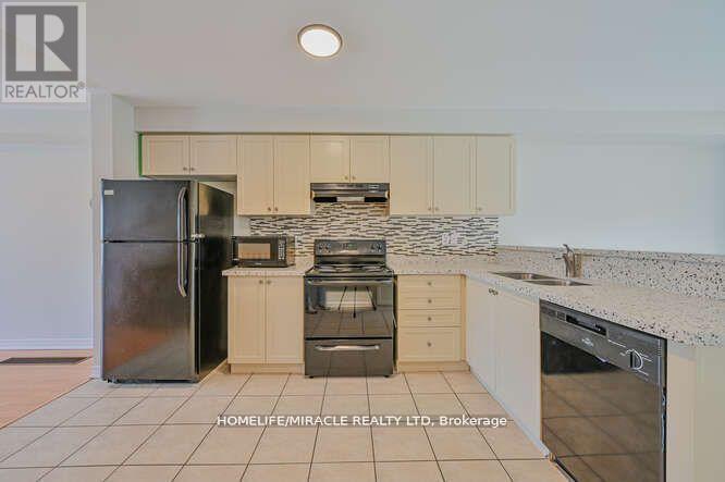 45 Peach Drive, Brampton, ON - Indoor Photo Showing Kitchen With Double Sink