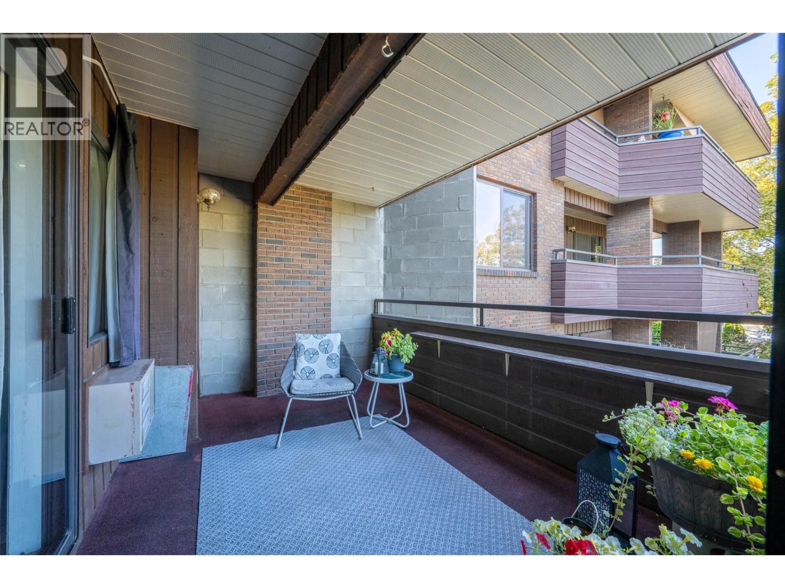 lovely covered deck with covered outdoor space - 1801 32 Street Unit# 203, Vernon, BC - Outdoor With Exterior