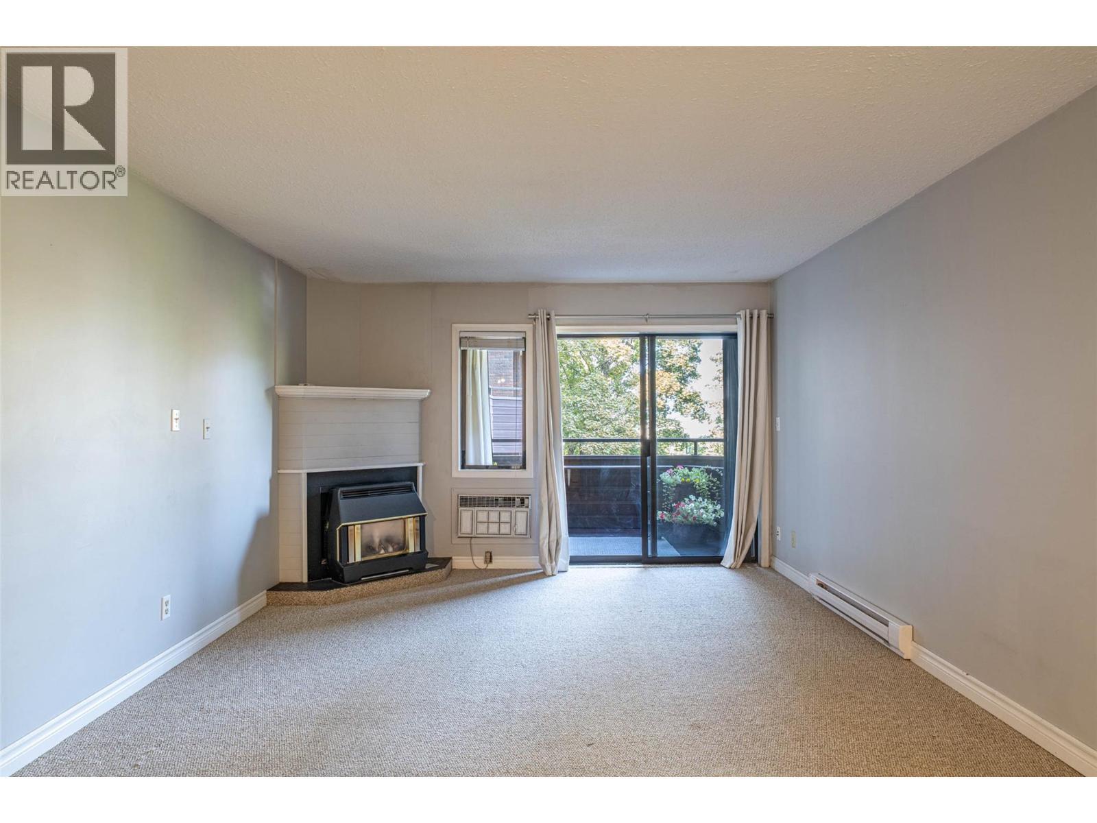 1801 32 Street Unit# 203, Vernon, BC - Indoor With Fireplace