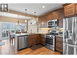 Dishwasher, microwave oven, propane gas stove and refrigerator are all included (wine cabinet hidden by the dining area) -