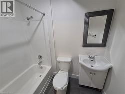 Full bath featuring washtub / shower combination and vanity -