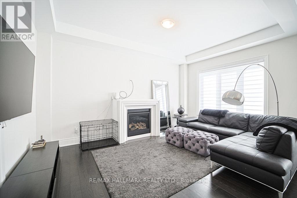 Family Room - 25 Kentledge Avenue, East Gwillimbury, ON - Indoor Photo Showing Living Room With Fireplace
