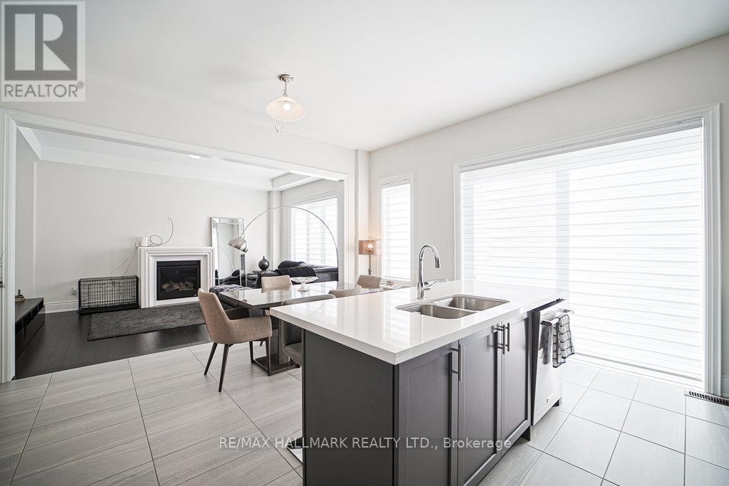 Kitchen - 25 Kentledge Avenue, East Gwillimbury, ON - Indoor Photo Showing Kitchen With Fireplace With Double Sink