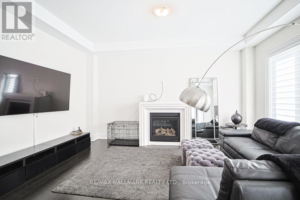 Family Room - 25 Kentledge Avenue, East Gwillimbury, ON - Indoor Photo Showing Living Room With Fireplace