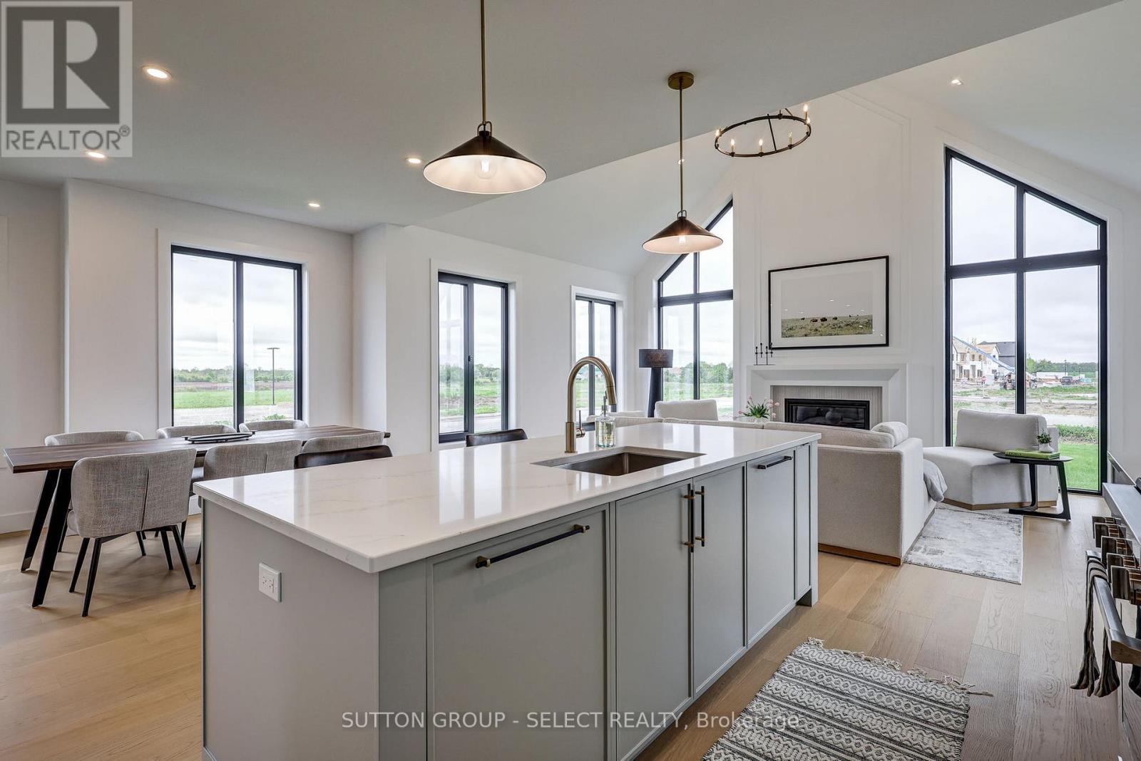 2 Five Stakes Street, Southwold, ON - Indoor Photo Showing Kitchen With Fireplace