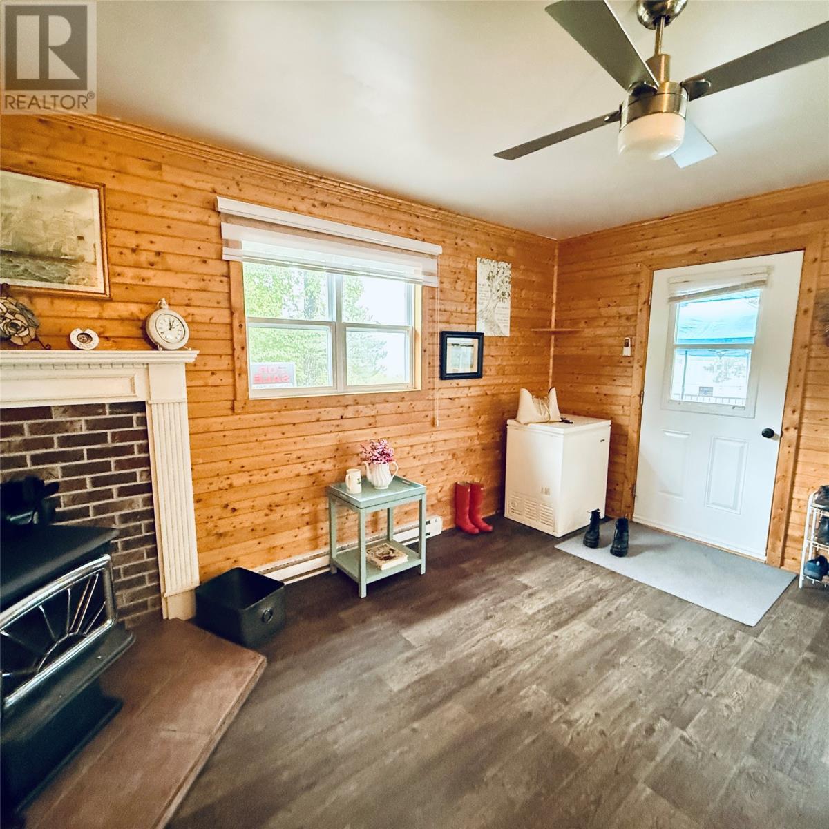 3 Robert Road, South Brook, NL - Indoor Photo Showing Other Room With Fireplace